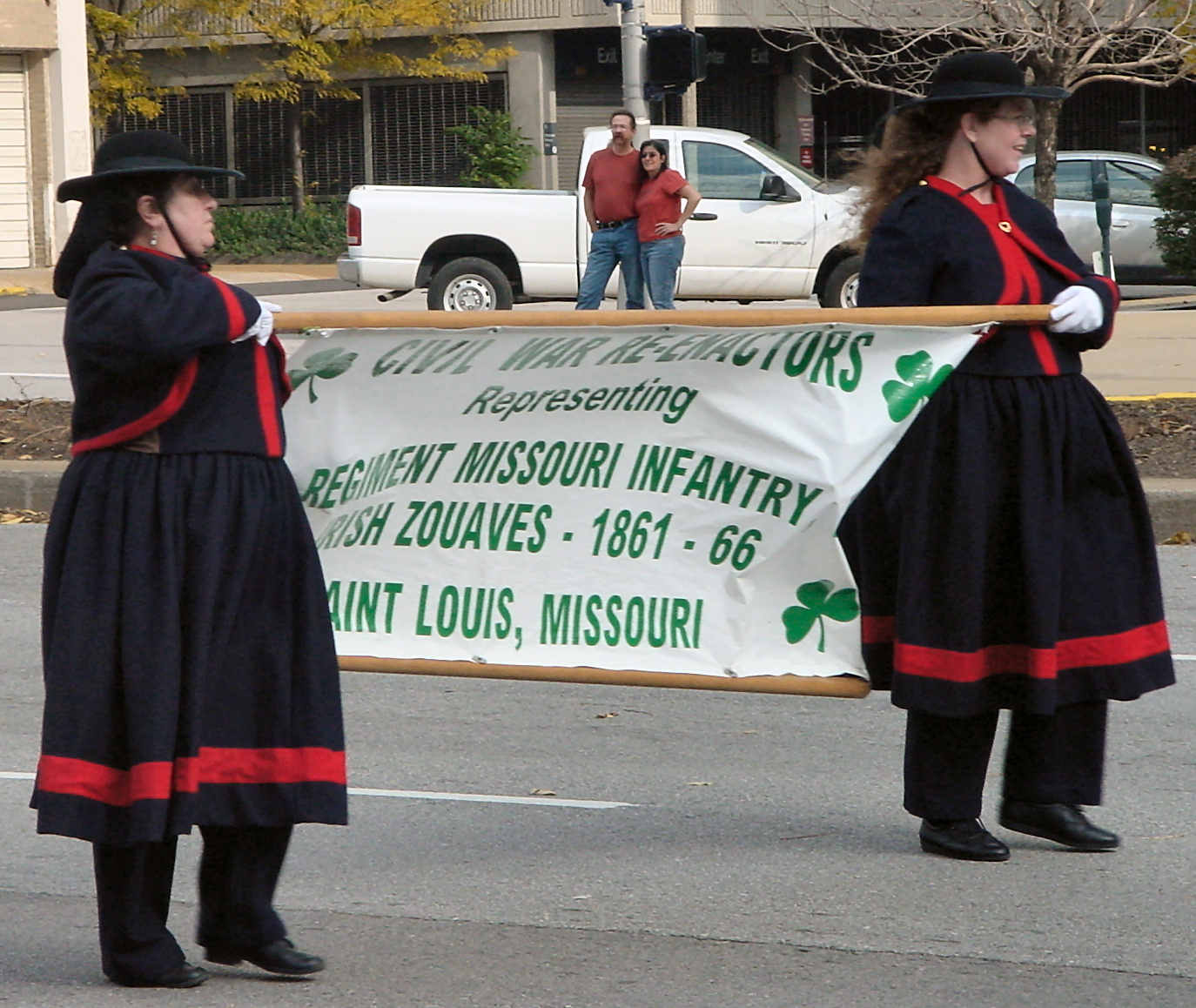Women carrying banner in parade